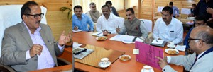 Deputy Chief Minister, Dr Nirmal Singh chairing a meeting at Srinagar on Friday.