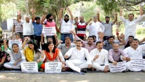 NPP leaders and activists staging protest dharna in Jammu on Sunday. -Excelsior/ Rakesh