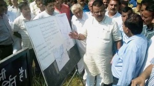 Industries Minister Chander Parkash Ganga kick starting construction of Basantar river embankment on Sunday.