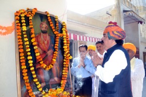 MLC Ajatshatru Singh and other members of Dharmarth Trust paying tributes to Maharaja Gulab Singh at Raghunath Mandir Jammu on Wednesday.