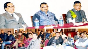 Minister for Industries, Chander Parkash Ganga addressing a gathering of cross-LOC traders and representatives of various trade bodies at Srinagar on Sunday.