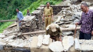 Forest officials removing encroachments in Doda forest division. -Excelsior/ Tilak Raj