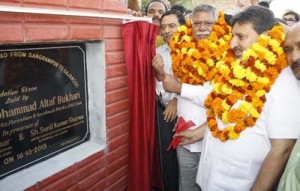 Ministers Altaf Bukhari and Sukhnandan Kumar laying foundation stone of road on Friday.