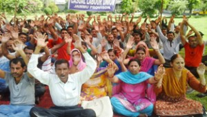 Casual labours of Agriculture Department raising slogans during protest at Jammu on Monday.