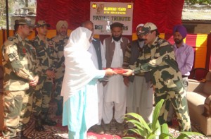 Family members of BSF martyrs being felicitated  by a senior officer during a function at Khanetar in Poonch on Wednesday.