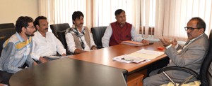 Deputy Chief Minister, Dr Nirmal Singh interacting with a deputation of Gaddi-Sippi at Srinagar on Wednesday.