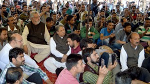 PCC leaders sitting on dharna with agitating daily wagers at Srinagar on Wednesday.