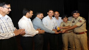 Winners of symposium receiving prize from SSP Shiv Kumar Sharma at Sher-i-Kashmir Police Academy, Udhampur.