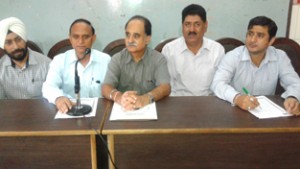 Scientists of SKUAST-J addressing a press conference at Jammu on Tuesday. 