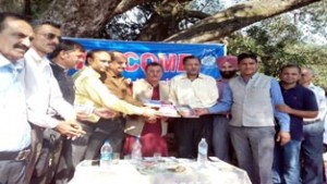 Writers displaying publications of JKAACL during function at GDC Jindrah.