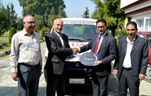 JKB Executive President handing over keys of ambulance to VC SKUAST-Kashmir on Thursday.