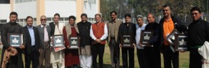 Speaker, Kavinder Gupta alongwith awardees posing for a photograph at Srinagar. 