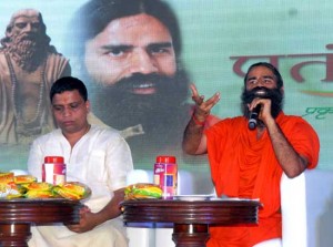 Yoga Guru Baba Ramdev (R) with Acharya Balkrishna, MD, Patanjali Ayurved, addressing a press conference after launching 'Patanjali Atta Noodles, in New Delhi on Monday. (UNI)