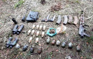 Arms and explosives recovered by Army and police at Dachan, Ramban on Monday. 