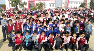 Students of RM Public School posing for a photograph after winning medals in Kick Boxing Championship.