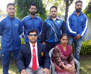 Selected State Powerlifters posing alongwith Mandeep Kour and Rajan Jain in Jammu on Monday. 