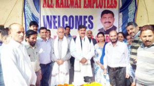 MPs, Jugal Kishore Sharma and Shamsher Singh Manhas posing for a photograph with Railway employees on Monday.