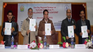 MoS for Public Works Sunil Sharma and others releasing souvenir of Regional Seminar at Bhaderwah Campus on Thursday.