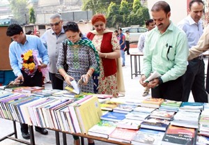 Students and faculty members during book exhibition at MIER on Tuesday.