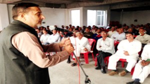 PCC leader Sham Lal addressing public meeting at Akhnoor on Sunday.