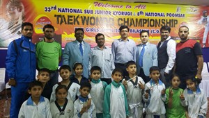 State Taekwondo players posing for a group photograph after excelling in National Championship.