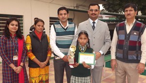 Student being felicitated during prize distribution function organized by Helpage India.
