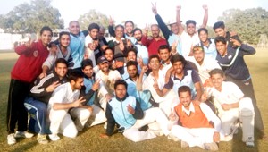 Jubilant players of J&K U-19 Cricket team showing victory signs while posing for a photograph after beating Punjab at GGM Science College Hostel ground on Tuesday.