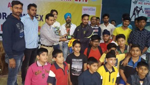 Winners of Kick Boxing Championship posing for a group photograph alongwith dignitaries at MA Stadium in Jammu on Saturday.