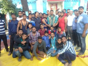 Young wrestlers posing for a group photograph alongwith Dushyant Sharma, former president Wrestling Federation of India.  