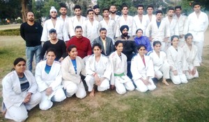 State Judokas posing for a group photograph alongwith  dignitaries in Jammu before leaving for Vadodara.