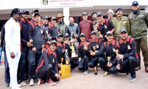 Winners Sheena Kings Eleven team players showing victory signs while posing for a group photograph alongwith Army officers in Kargil on Monday.