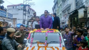 WWE star, Great Khali visiting Katra town in an open jeep on Monday.
