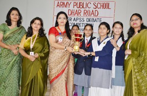 Winners of debate competition being felicitated at APS Dhar Road in Udhampur on Saturday. 