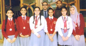 Students of KC Public School who represented Jammu Province Football team posing alongwith their Principal and coach.