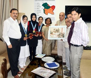 NSS Volunteers posing for a group photograph alongwith Sangeeta Gupta, Principal Commissioner Income Tax in Jammu on Tuesday. 