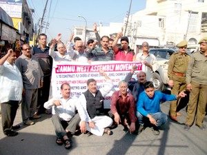 JWAM activists and others during a protest on Janipur-High Court Road in Jammu on Monday.