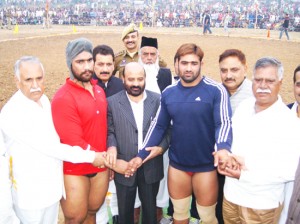 Minister for Social Welfare, forests Ecology and Environment, Bali Bhagat felicitating wrestlers during wrestling Competition on Sunday. 