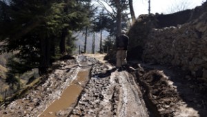 A man walking on dilapidated road leading to Manigah from Glass Daji in north Kashmir’s Kupwara district. —Excelsior/Aabid Nabi