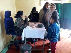 A doctor examining patients during a Medical Camp at Sopore.