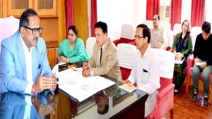 Dy Chief Minister, Dr Nirmal Singh chairing a meeting at Jammu on  Tuesday.