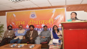 A poetess reciting her poem during Mushaira on eve of Diwali in Jammu on Tuesday.