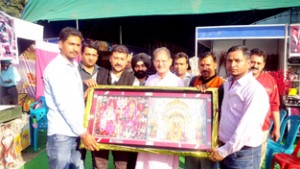 Speaker Legislative Assembly Kavinder Gupta being felicitated by organisers of trade-fair-cum-exhibition-cum-sale at Gandhi Nagar on Thursday 