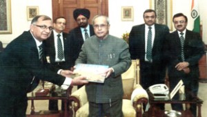 Dr Deepak Dogra, president, IIT Delhi Alumni Association, presenting his book to the President of India, Pranab Mukherjee at New Delhi.