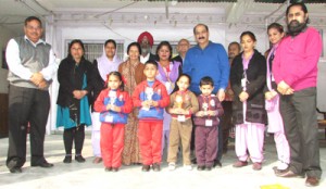 Winners of Painting Competition posing for a group photograph with chief guest RC Puri on Tuesday.