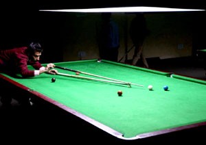 Cueist Rohit Sharma aiming a shot during pre-quarterfinal match of Junior Snooker Championship at Billiards Hall, MA Stadium in Jammu.      —Excelsior/Rakesh