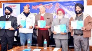 Dignitaries releasing special issue of Sheeraza at K L Saigal Hall on Wednesday.