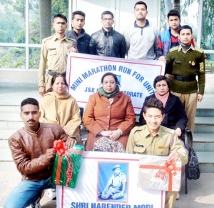 Winners of Half Marathon posing alongwith Principal at MA College in Jammu.