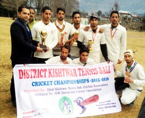 Winners Kishtwar Warriors holding trophy while posing for a group photograph on Monday.