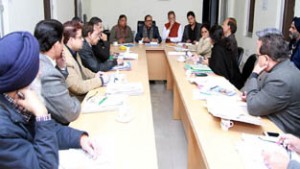 DyCM Dr Nirmal Singh chairing a meeting at Jammu on Saturday.