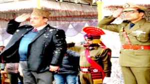 Deputy Commissioner Ganderbal Aizaz Bhat saluting National Flag during Republic Day Parade at Ganderbal.